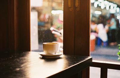 Coffee cup on table in cafe