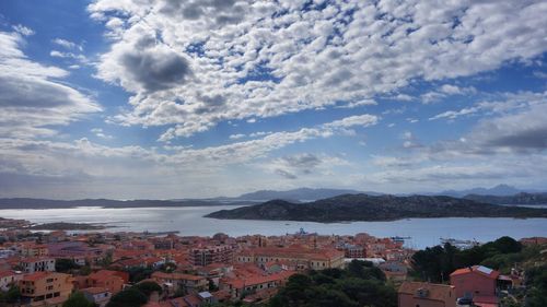Town against cloudy sky