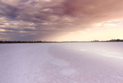 Scenic view of lake against sky during winter