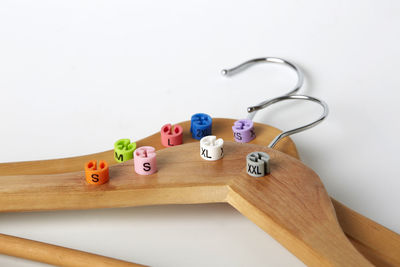 Close-up of toys on table against white background