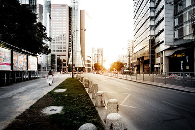 Road in city against clear sky