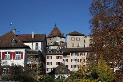 Low angle view of buildings against clear sky