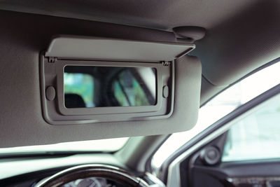 Close-up of mirror in car