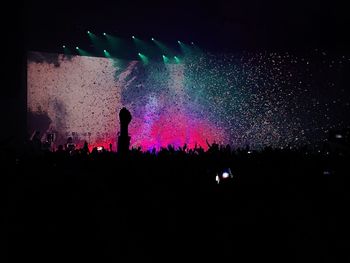 Firework display at night