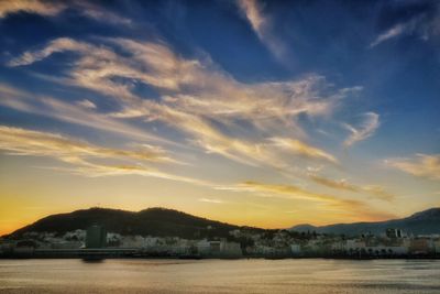 Scenic view of silhouette mountains against sky at sunset