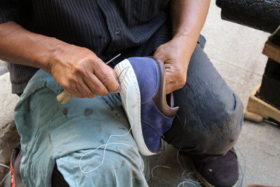 High angle view of man holding hands