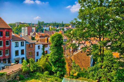 Buildings in town against sky