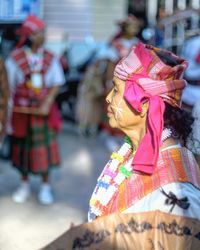 Side view of woman wearing traditional clothing during festival