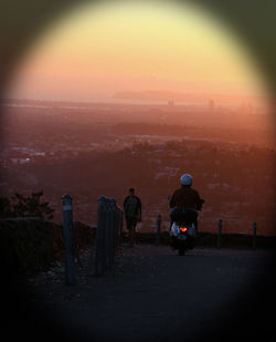 Silhouette of woman at sunset