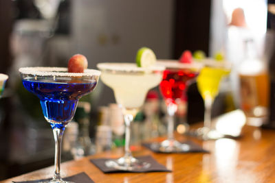 Close-up of colorful cocktails on counter