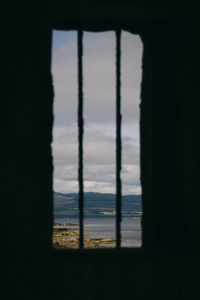 Reflection of sky on silhouette window