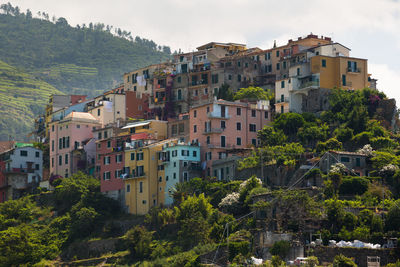 Buildings in town against sky