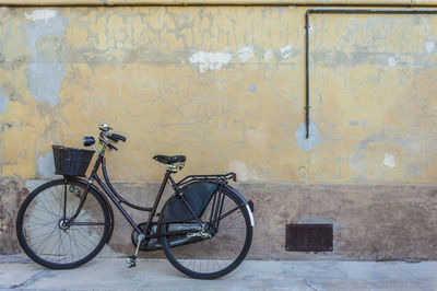 Bicycle against brick wall