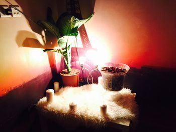 Close-up of illuminated lighting equipment on table