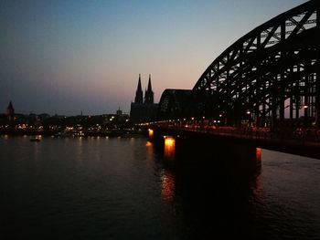 View of bridge over river and buildings in city