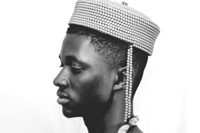 Close-up of young man against white background