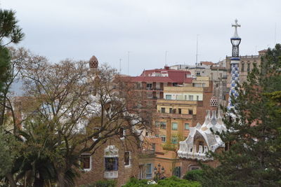 Houses in town against sky, park guell barcelona