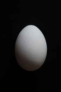 Close-up of apple against black background