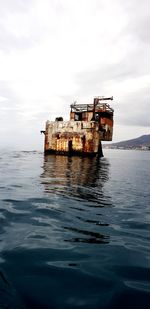 Ship in sea against sky