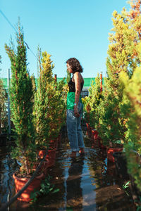 Full length of man standing by lake against sky