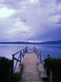 Pier over sea against sky