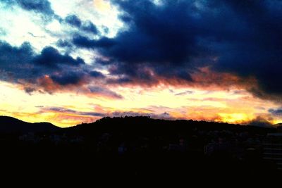 Scenic view of landscape against cloudy sky