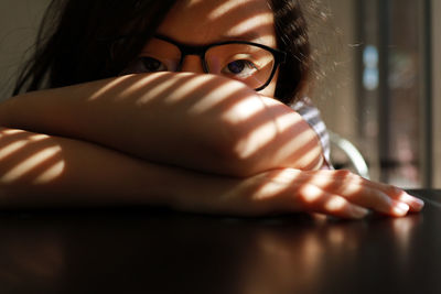 Close-up portrait of girl wearing eyeglasses