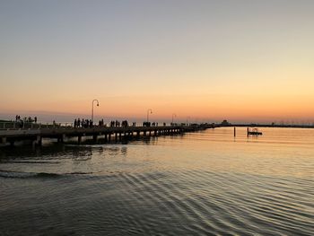 Scenic view of sea against clear sky during sunset