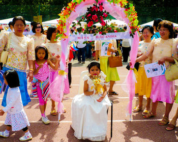 Group of people in traditional clothing standing outdoors