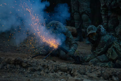 Soldiers holding equipment