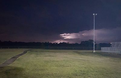 Scenic view of field against sky at night