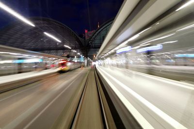 Blurred motion of train at railroad station at night