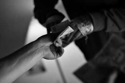 Close-up of hand holding money