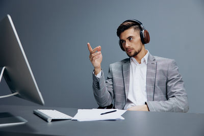 Portrait of businessman using mobile phone