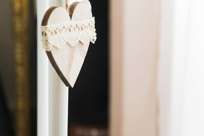 White decorated wooden heart hanging