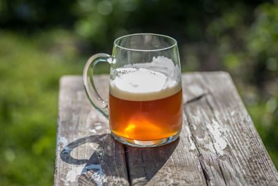 Close-up of beer glass on table