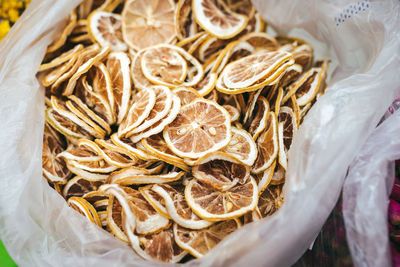 High angle view of dry lemon slices for sale at market