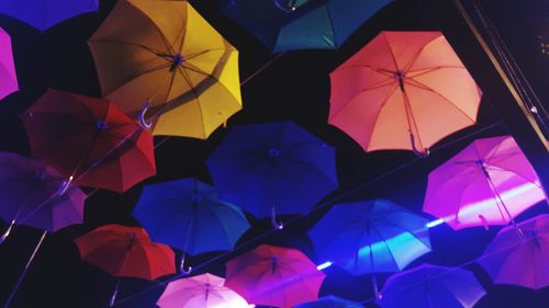 High angle view of multi colored umbrella on wet glass