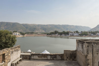 View of houses against mountain range