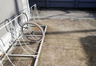 High angle view of bicycle wheel by building