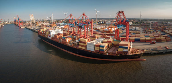 Panoramic view of pier at harbor against sky