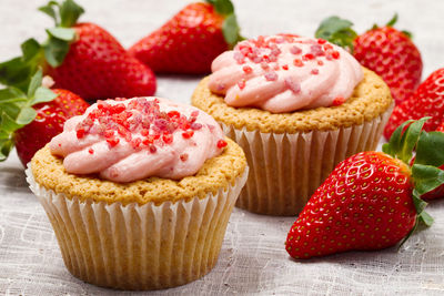 Close-up of cupcakes with strawberries