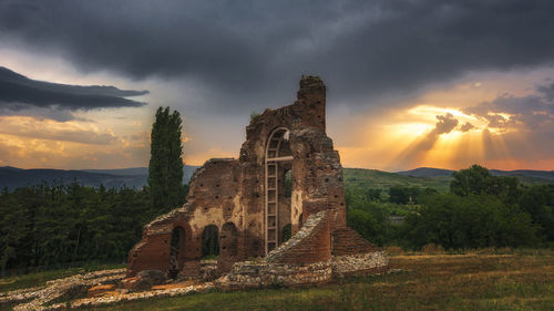 View of old ruin against cloudy sky