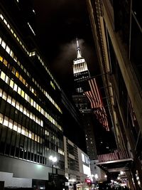 Low angle view of skyscrapers lit up at night