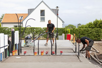 Men preparing concrete foundation