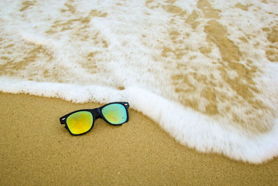 High angle view of toy on sand at beach