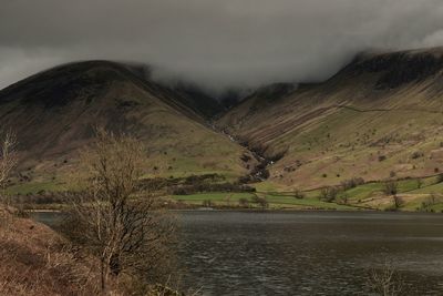 Scenic view of lake and mountains against sky