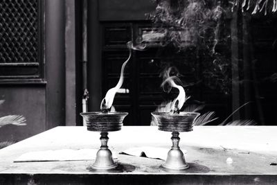 Close-up of lit lamps on table