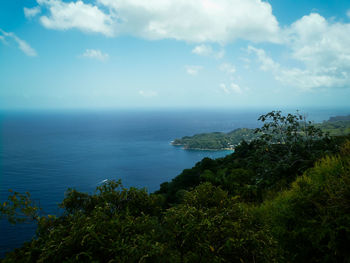 Scenic view of sea against cloudy sky