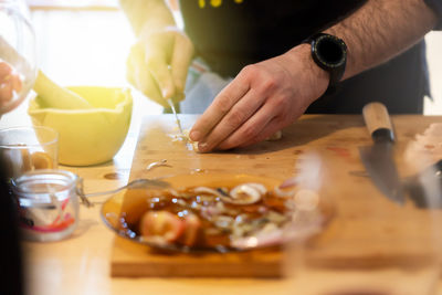 Midsection of person preparing food